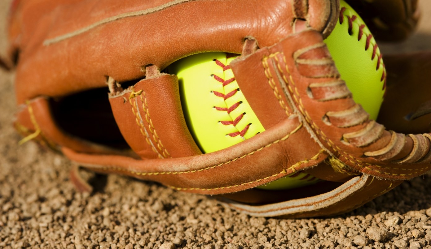 softball in baseball glove